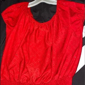 Red top with intentional holes.